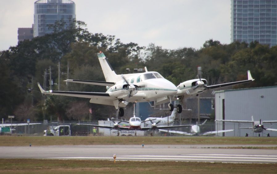 N850YR on approach at Orlando Executive Airport with downtown skyline