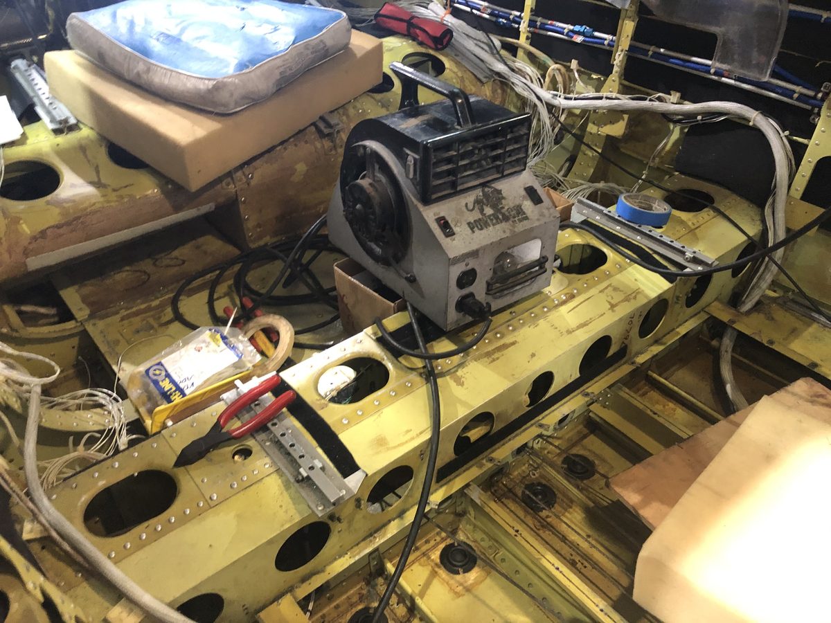 N850YR stripped to bare airframe during restoration — yellow zinc chromate visible